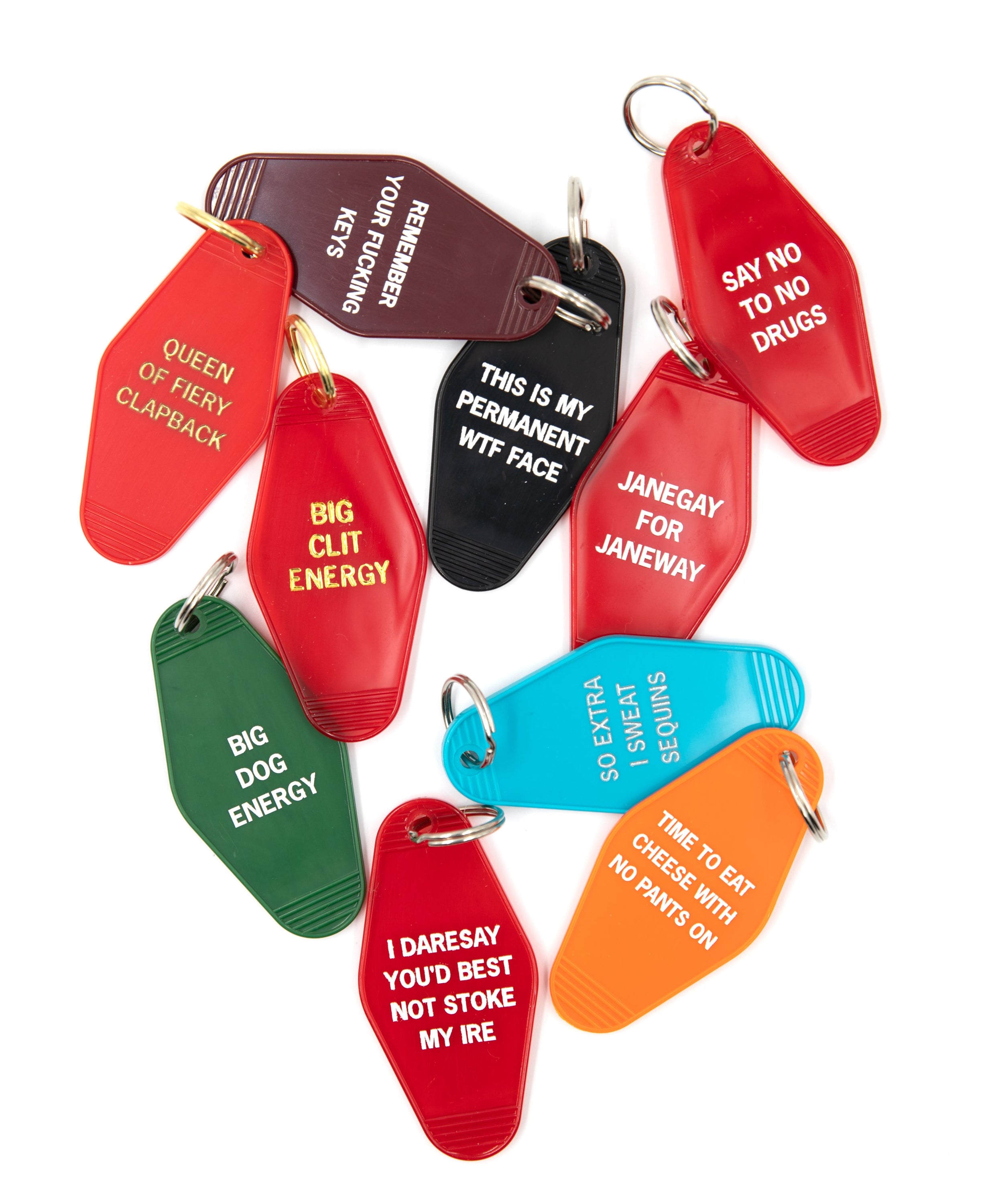 Red motel-style keychain with white lettering saying 'I Daresay You'd Best Not Stoke My Ire', featuring a split ring.