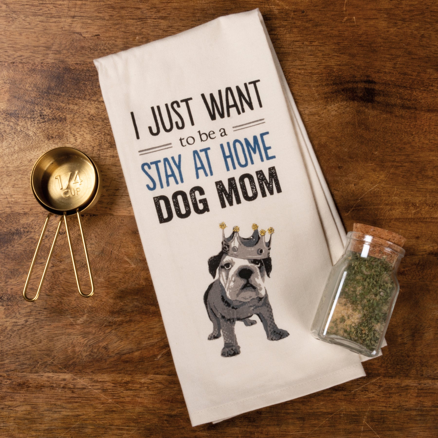 A cotton dish towel featuring the phrase 'I Just Want to Be a Stay at Home Dog Mom' in a stylish font, perfect for dog lovers.