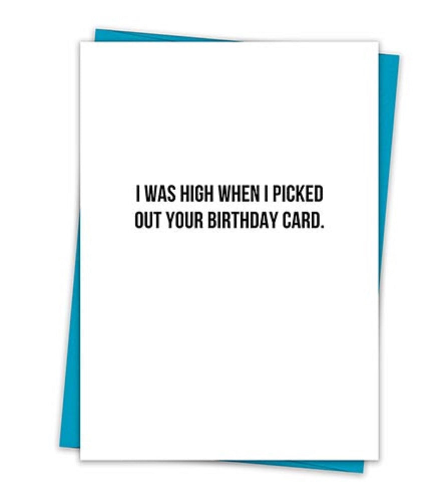 Humorous birthday greeting card with the text 'I Was High When I Picked Out Your Birthday Card' on a minimalist white background, accompanied by a teal envelope.