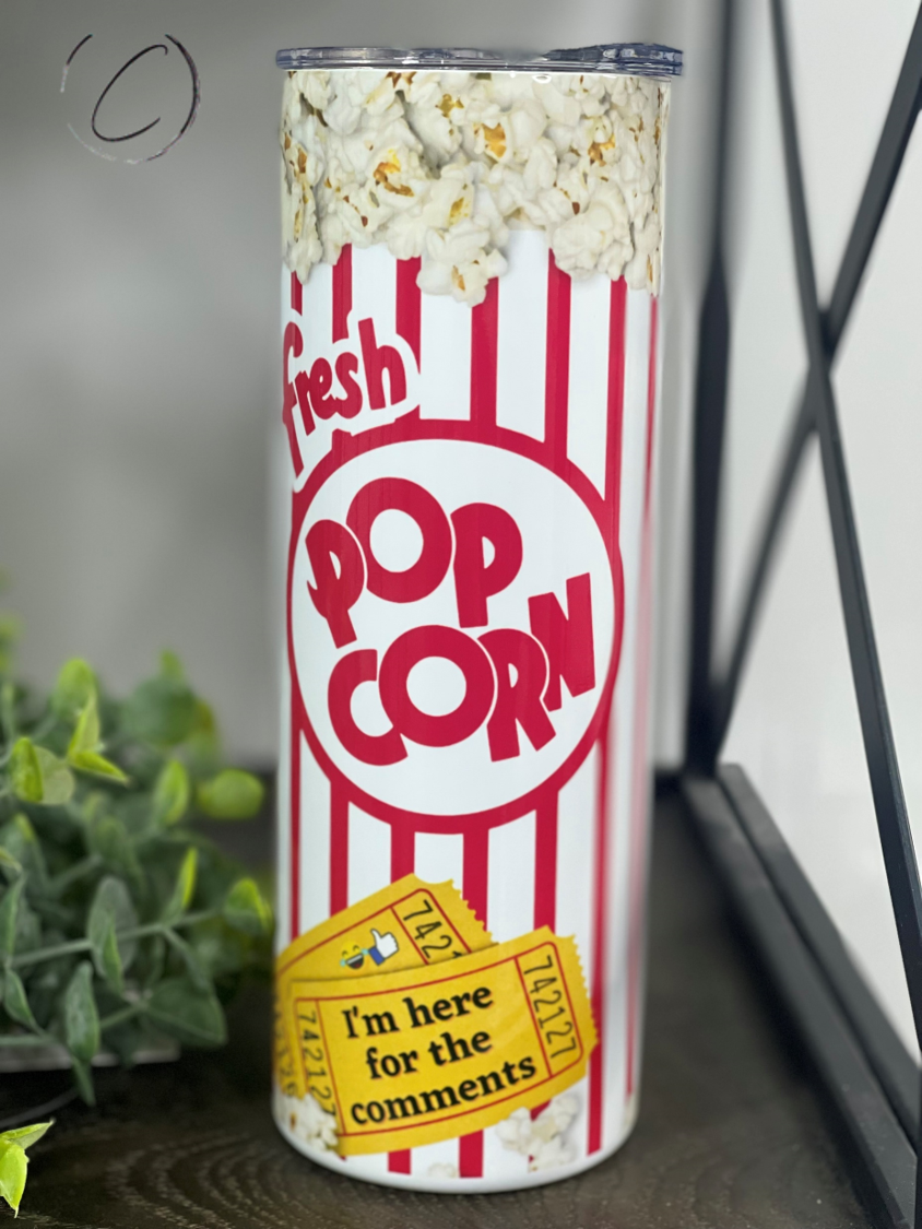 I'm Here For The Comments Popcorn 20oz Skinny Tumbler with a vibrant design, perfect for hot and cold beverages.