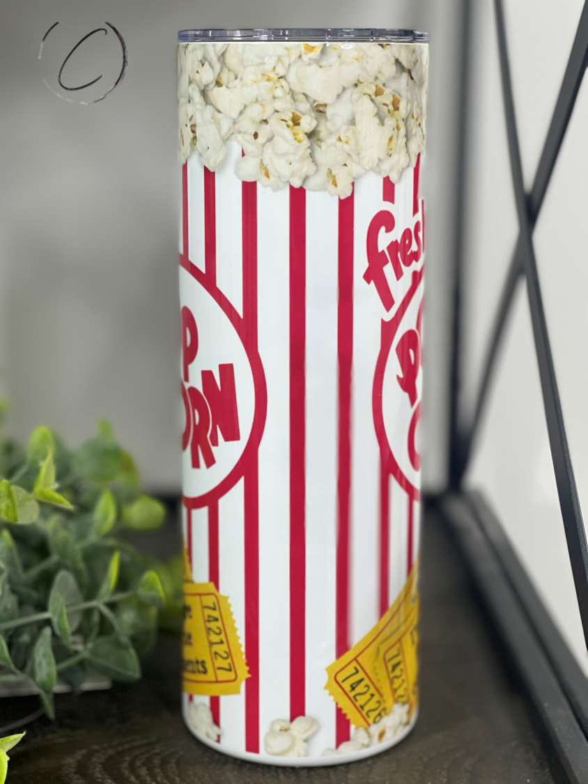 I'm Here For The Comments Popcorn 20oz Skinny Tumbler with a vibrant design, perfect for hot and cold beverages.