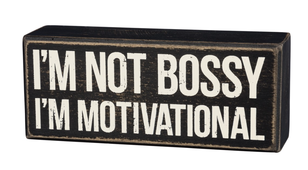 Rustic wooden box sign with white lettering reading 'I'm Not Bossy, I'm Motivational', perfect for home or office decor.