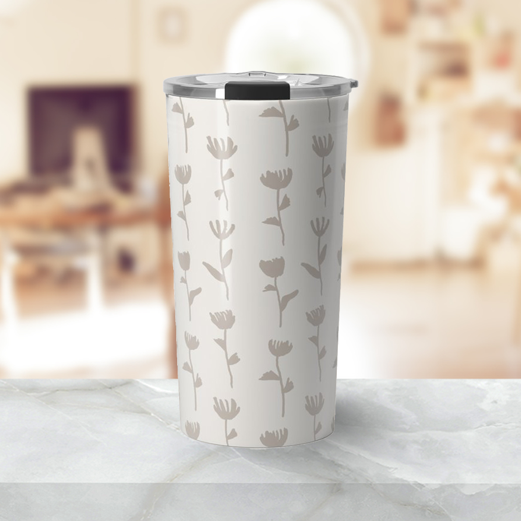 Ink Flower Travel Coffee Mug in stainless steel with vibrant floral design, showcasing double-wall insulation and a vacuum-sealed lid.