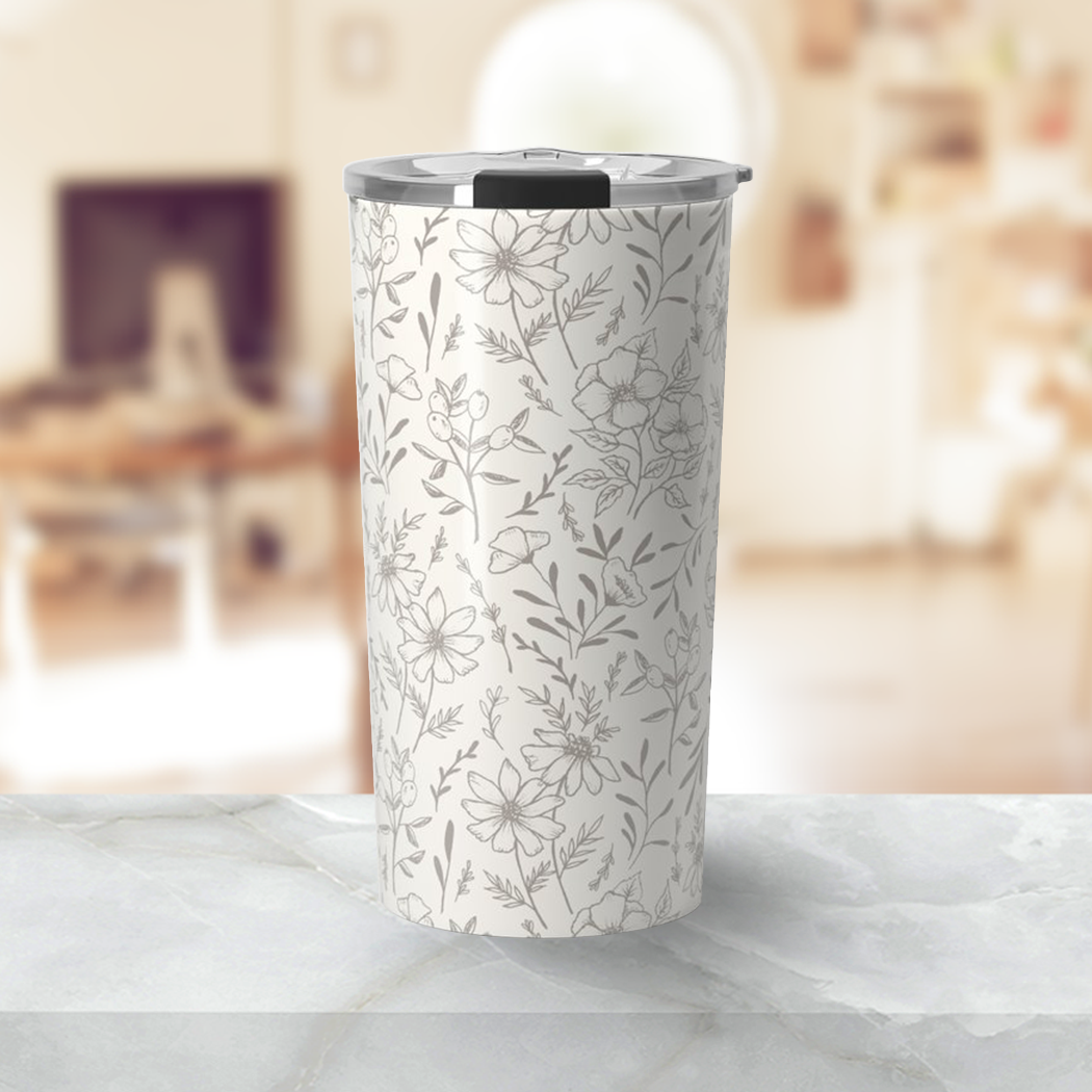 Ivory Flower Travel Mug featuring a floral design, made of stainless steel with a double-wall for insulation.