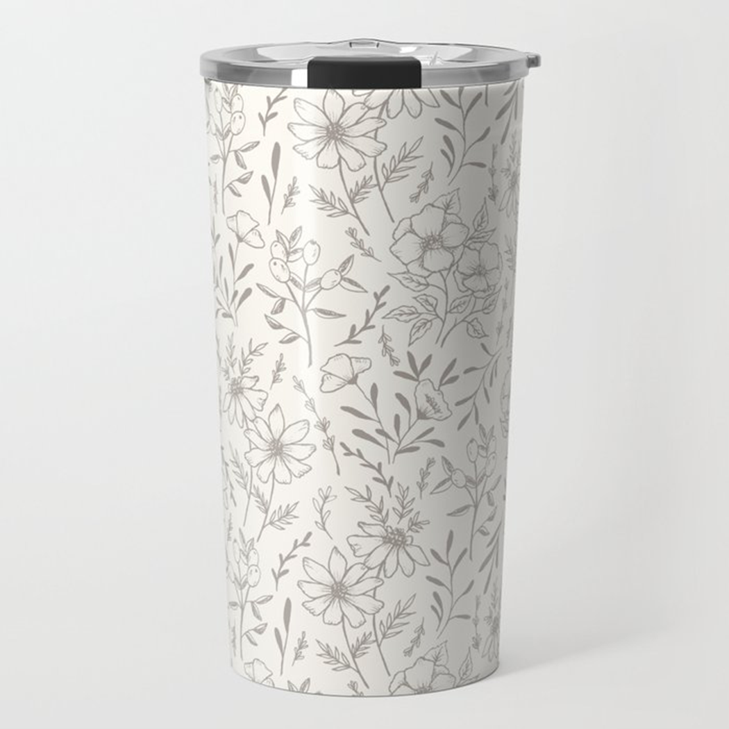 Ivory Flower Travel Mug featuring a floral design, made of stainless steel with a double-wall for insulation.