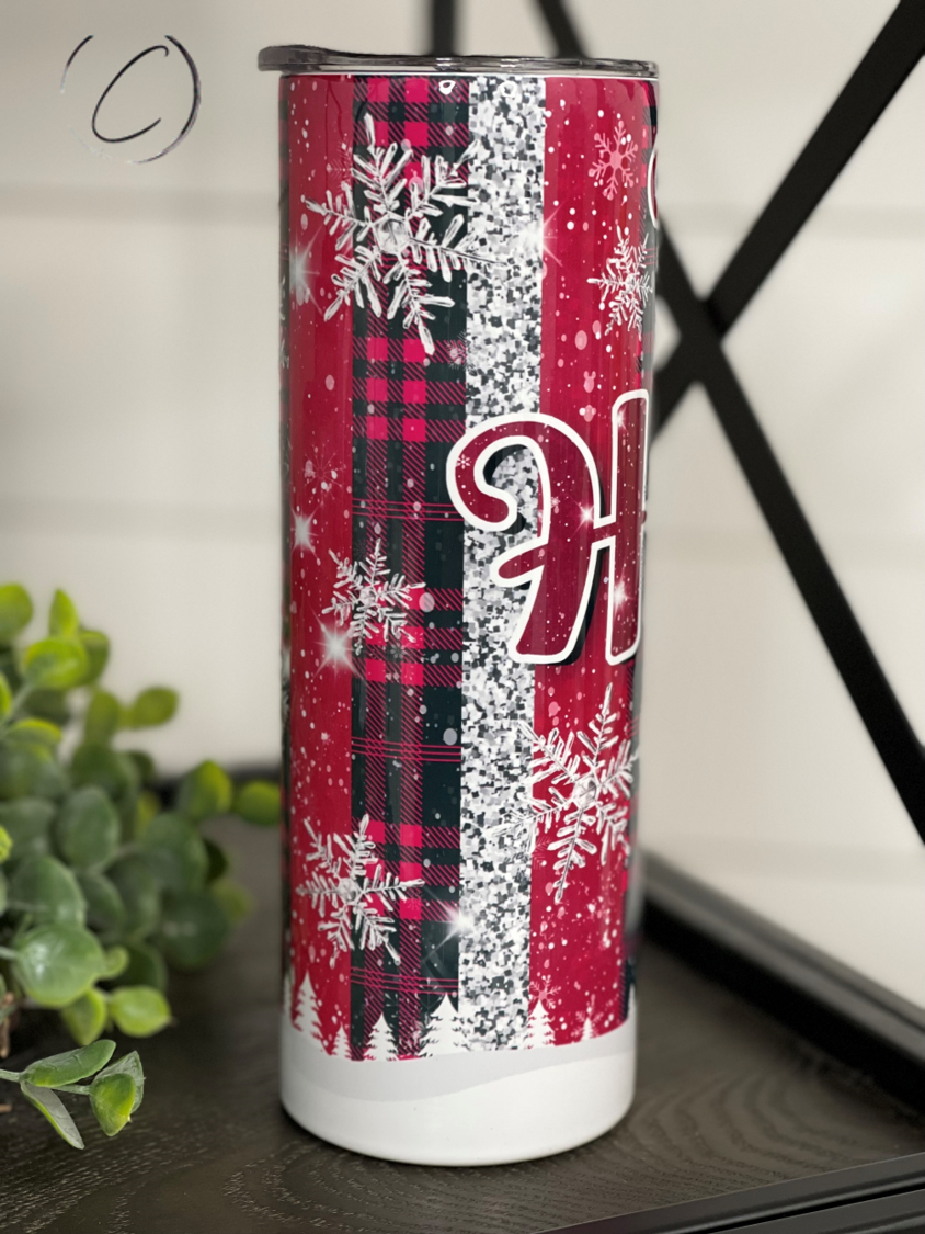 Jack Skellington Ho Ho Ho 20oz skinny tumbler featuring a festive design, perfect for hot and cold beverages.