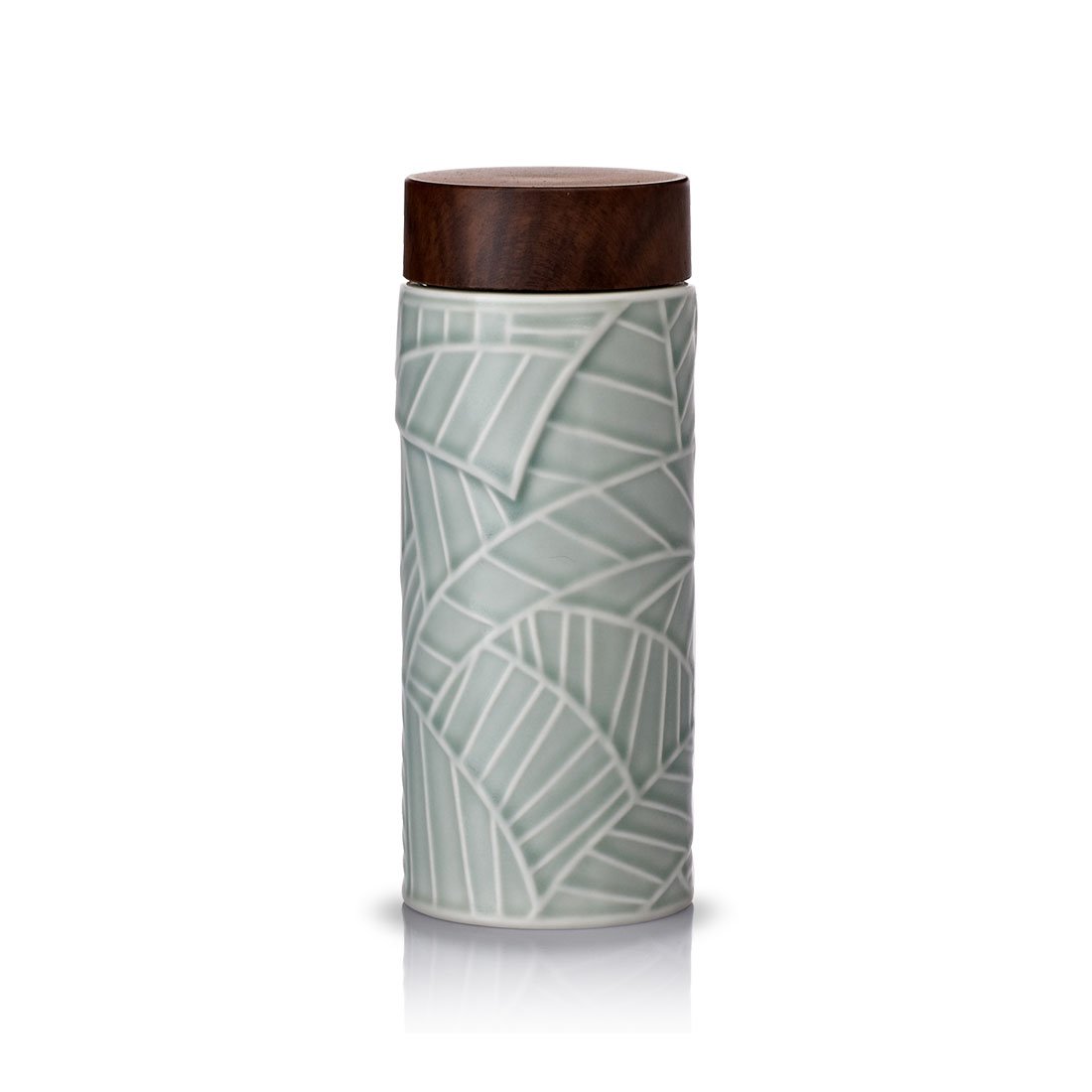 Jade Leaves Tea Tumbler with intricate engravings, showcasing its ceramic body and stylish ABS lid in walnut wood effect.