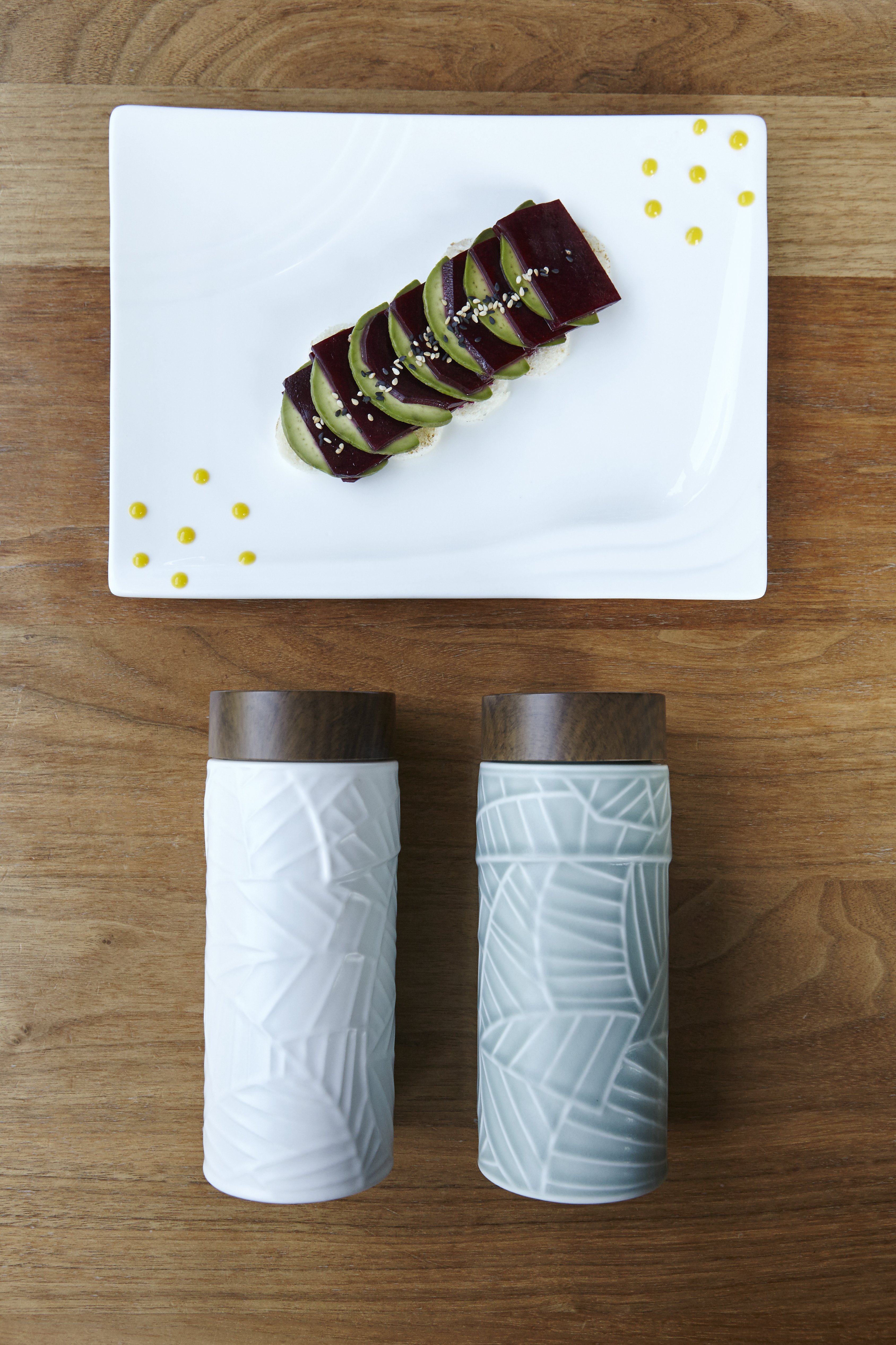 Jade Leaves Tea Tumbler with intricate engravings, showcasing its ceramic body and stylish ABS lid in walnut wood effect.