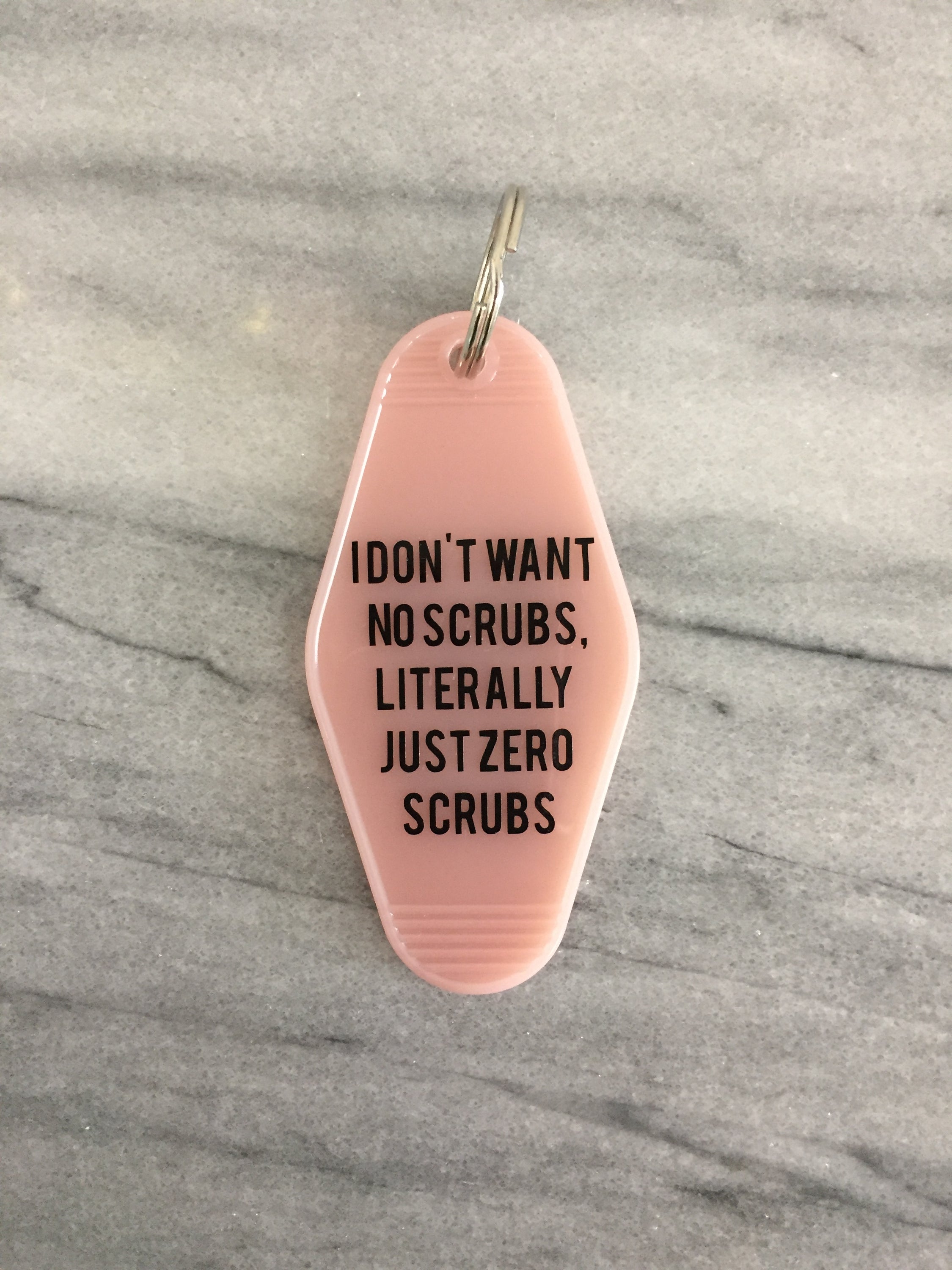 Pink keychain with black lettering reading 'I DON'T WANT NO SCRUBS, LITERALLY JUST ZERO SCRUBS', featuring a split ring attachment.