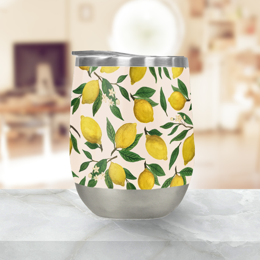 Lemon Blossom Stemless Wine Tumbler showcasing its elegant design and stainless steel construction, perfect for outdoor use.