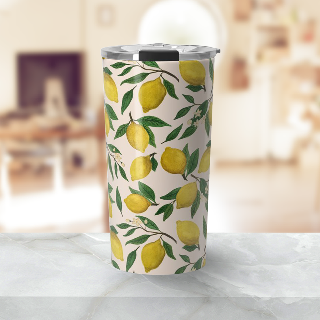 Lemon Blossom Travel Mug showcasing a vibrant floral design with a stainless steel finish, perfect for hot and cold beverages.