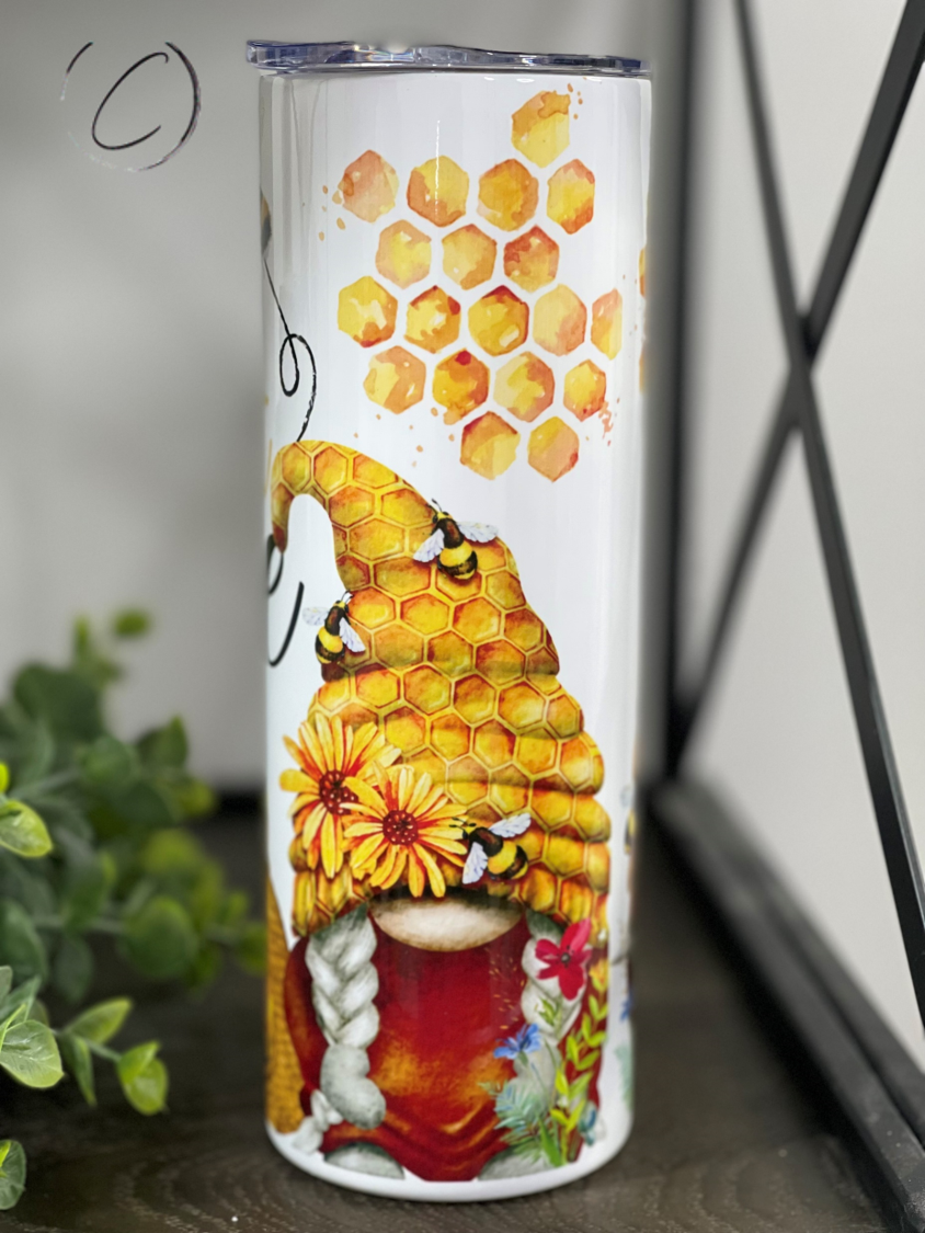 Let It Bee Gnomes 20oz Skinny Tumbler featuring a whimsical gnome design, perfect for hot and cold beverages.