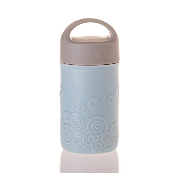 Liven Destiny Travel Mug featuring a tourmaline ceramic body, silicone cover, and convenient carrying handle, perfect for on-the-go hydration.