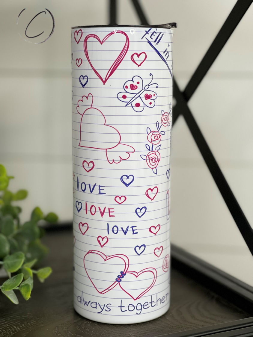 Love Notes 20oz Skinny Tumbler with a vibrant full wrap design, featuring a reusable straw and a sleek, durable finish.