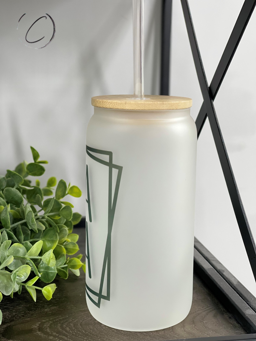 Mama Squared 16oz Libbey Glass tumbler with a reusable straw, showcasing a frost appearance and unique full wrap design.