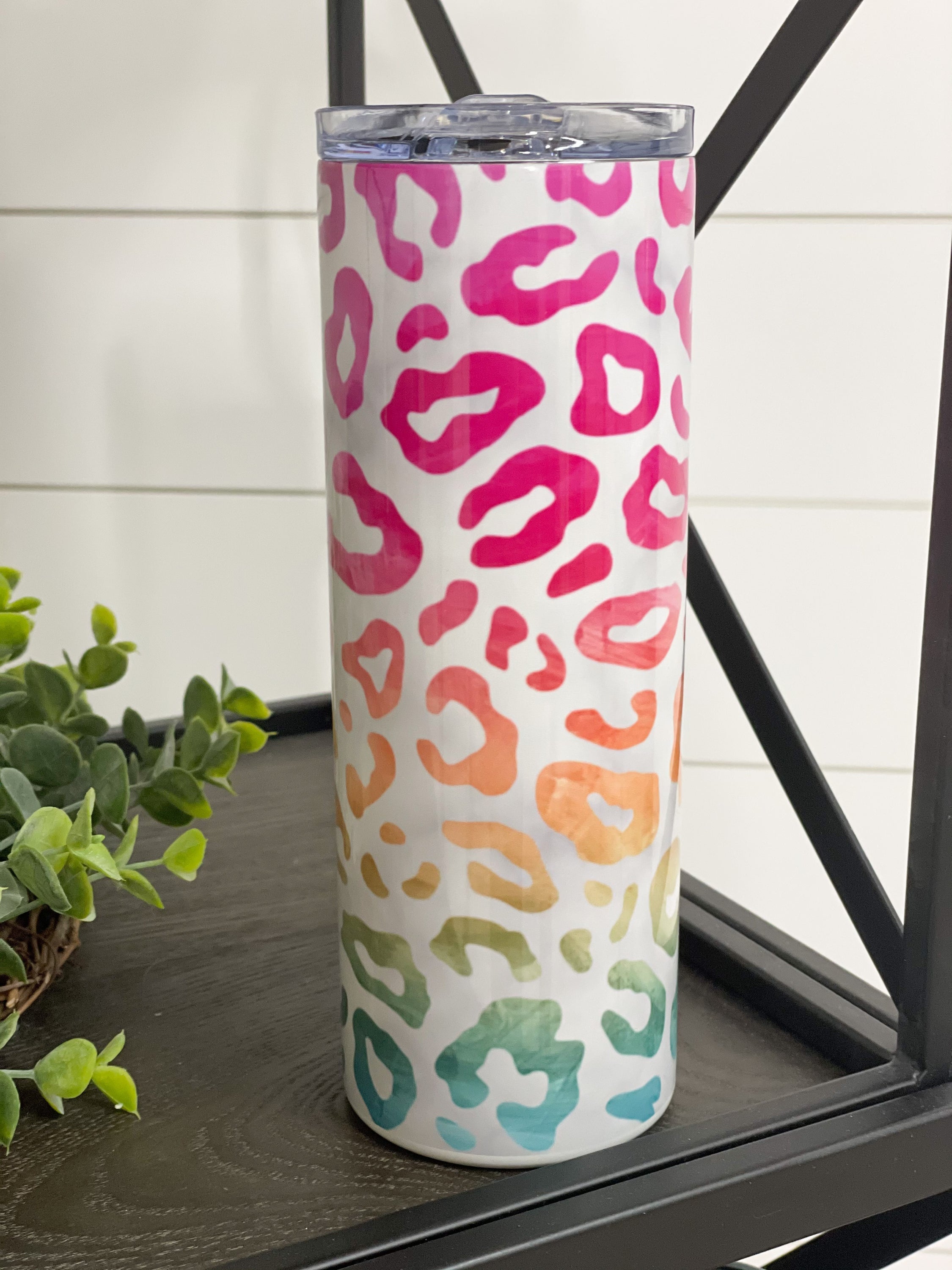 Marbled Ombre Leopard 20oz Skinny Tumbler with a stylish design and reusable straw, perfect for drinks on the go.