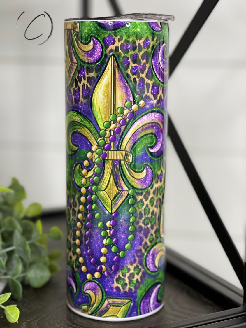 Mardi Gras Fleur-de-lis 20oz Skinny Tumbler with vibrant design and reusable straw.