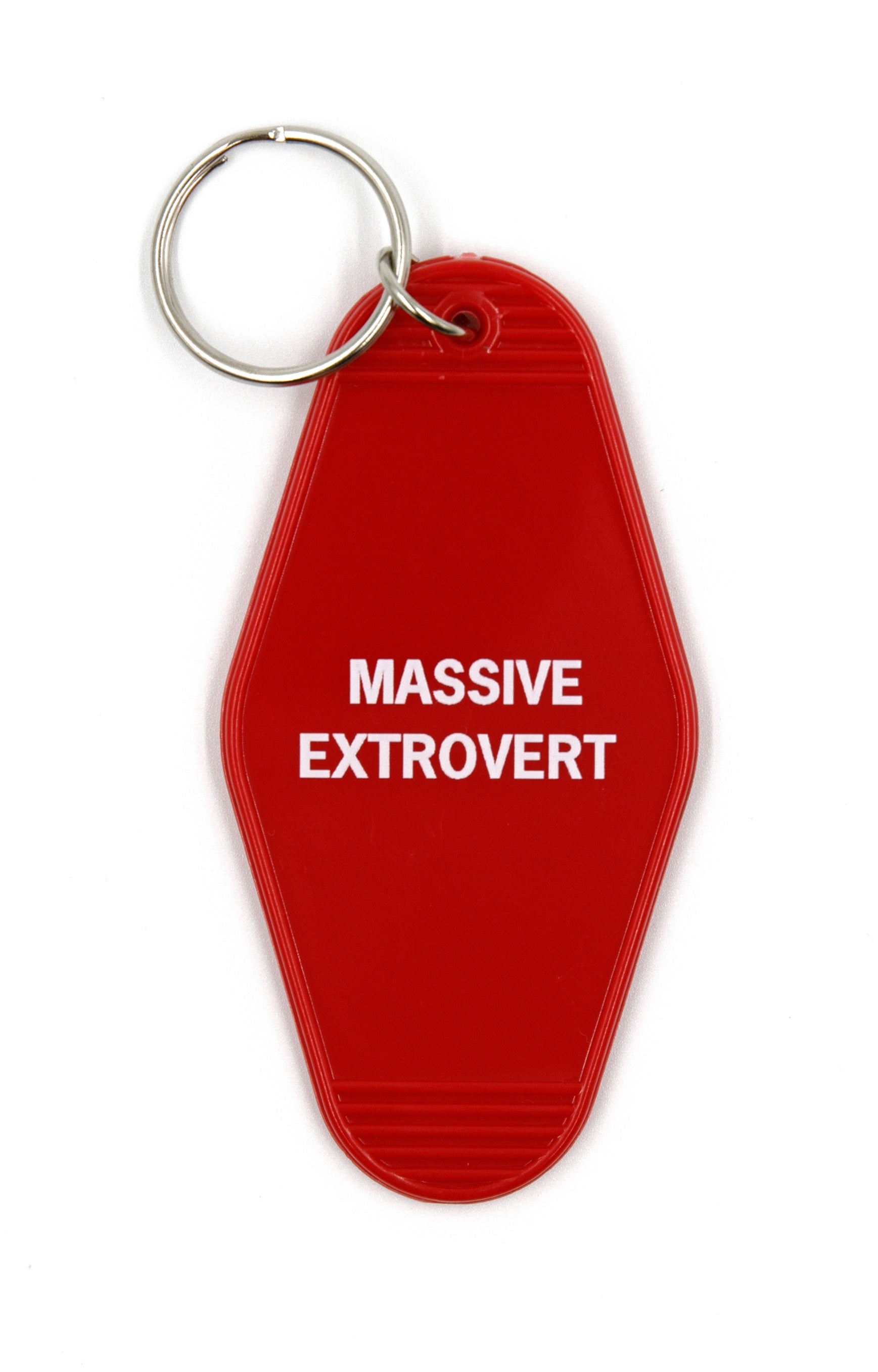 A vibrant red keychain with the words 'Massive Extrovert' in bold white lettering, featuring a classic motel key tag design.