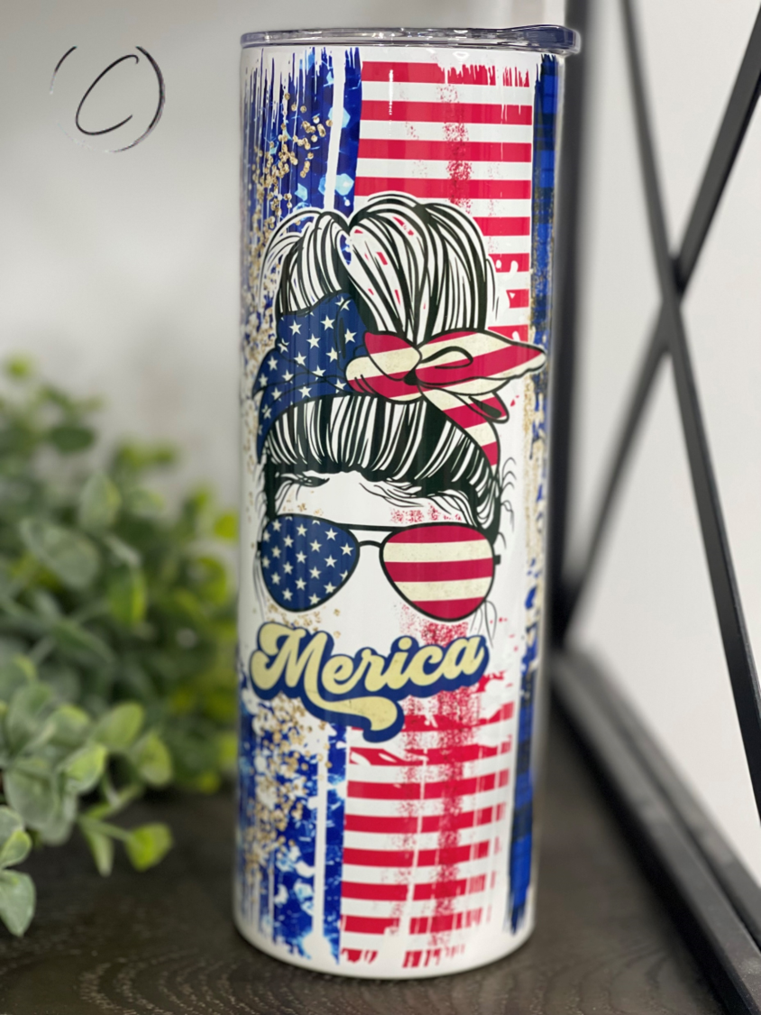 Merica 20oz Skinny Tumbler with full wrap design and reusable straw, showcasing vibrant colors and high-quality material.