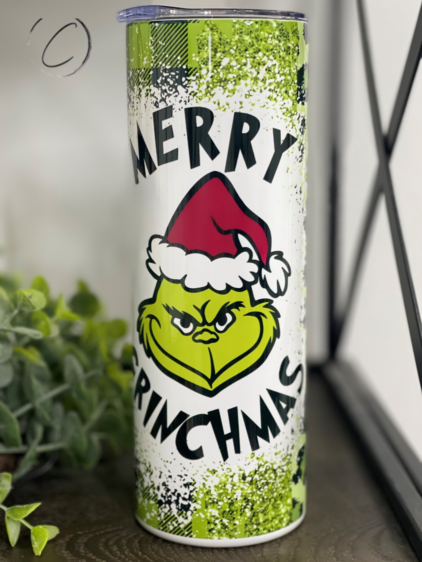 Merry Grinchmas 20oz Skinny Tumbler featuring a festive design, perfect for holiday drinks.