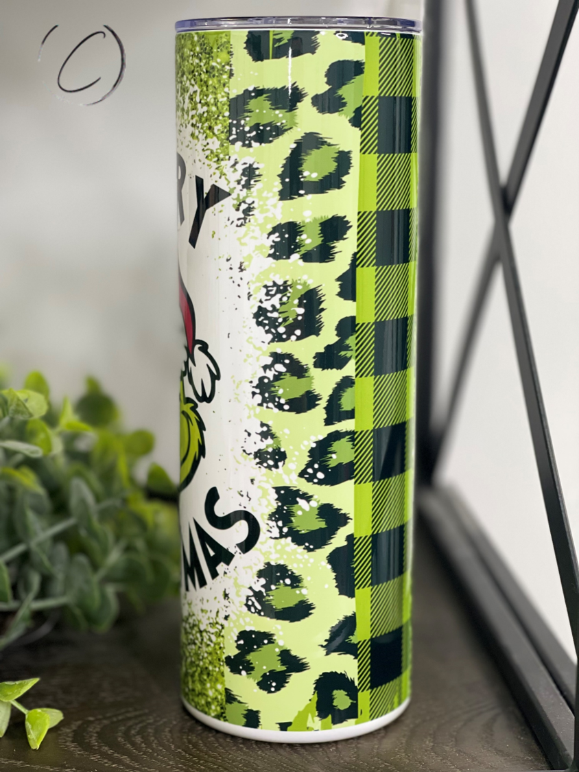 Merry Grinchmas 20oz Skinny Tumbler featuring a festive design, perfect for holiday drinks.