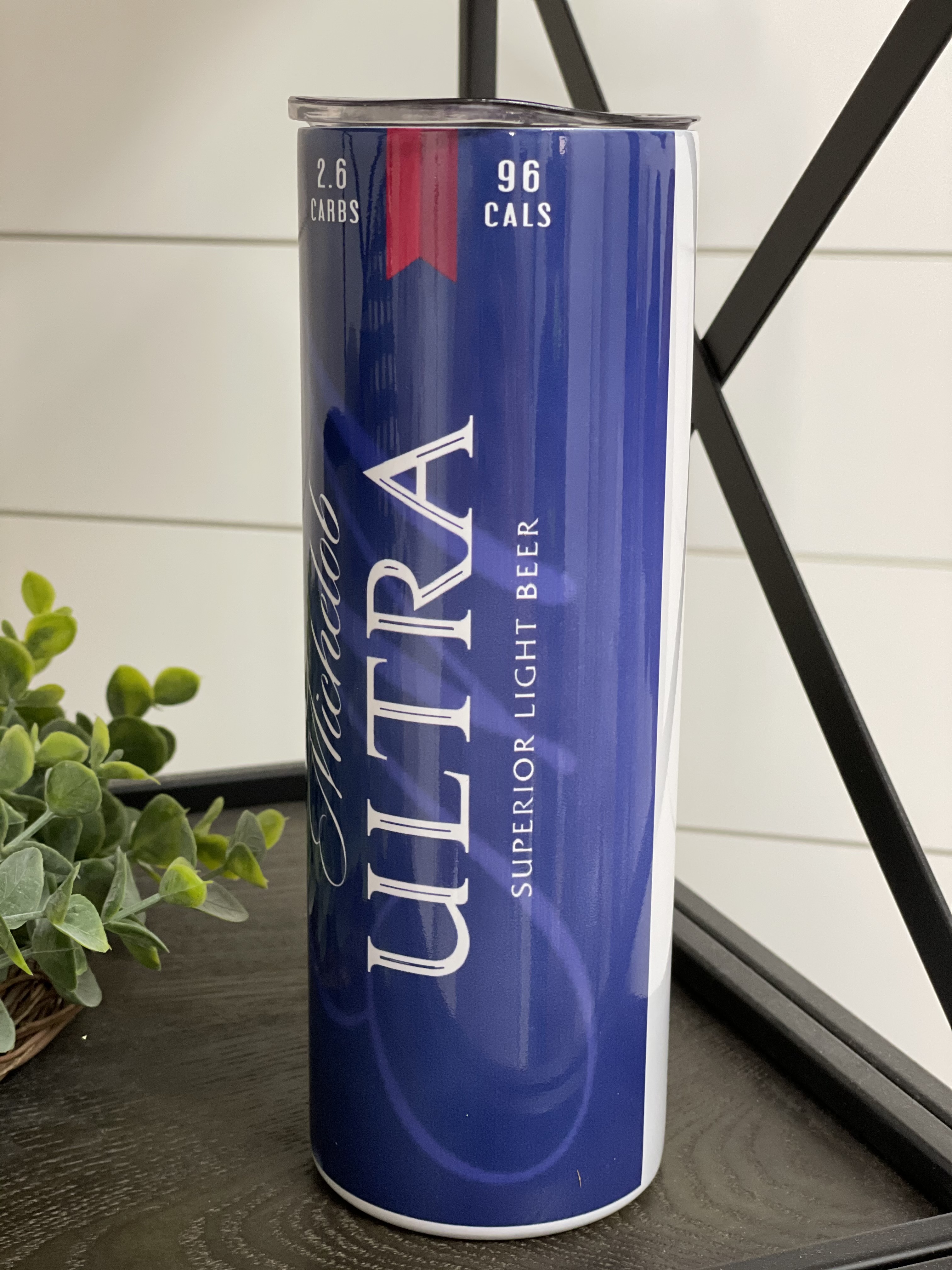 Michelob Ultra 20oz Skinny Tumbler with integrated design and reusable straw, showcasing its sleek and modern look.