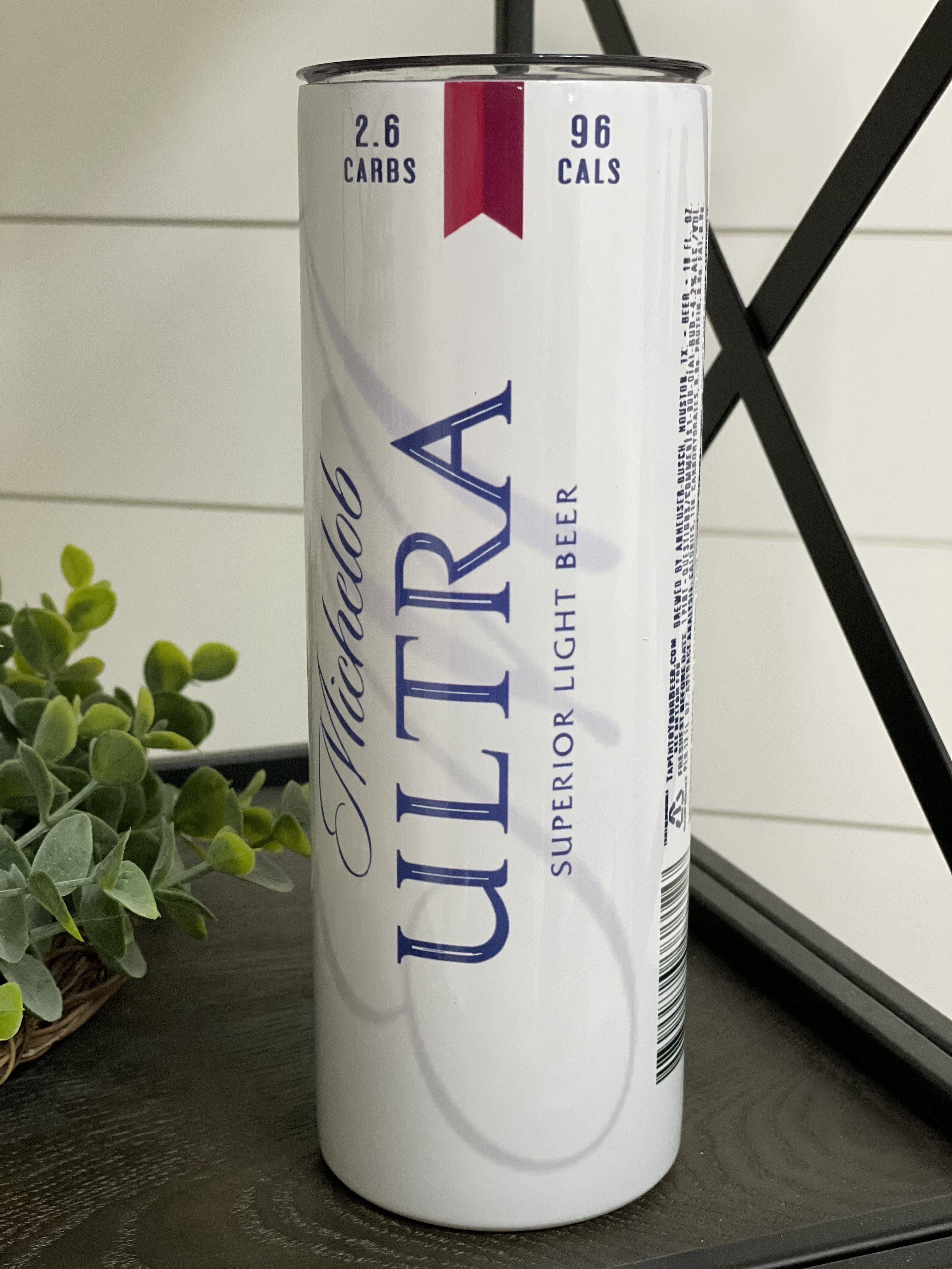 Michelob Ultra 20oz Skinny Tumbler with integrated design and reusable straw, showcasing its sleek and modern look.