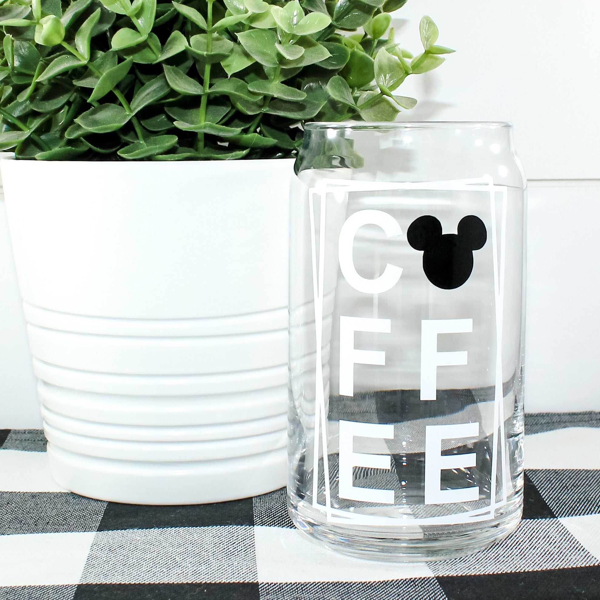 Mickey Coffee Can Glass featuring a vibrant Mickey design, perfect for beverages.