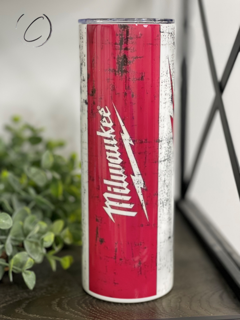 Milwaukee 20oz Skinny Tumbler with a vibrant full wrap design, featuring a reusable straw and durable construction.