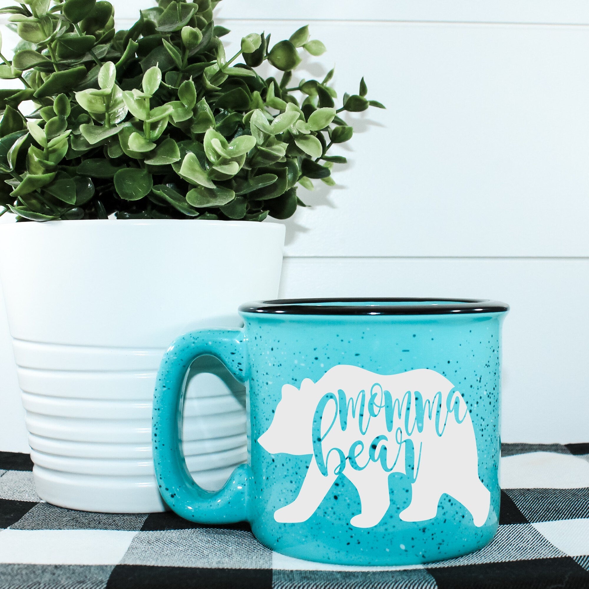 Momma Bear Campfire Mug, a ceramic mug with a unique vinyl design, perfect for outdoor adventures and cozy drinks.