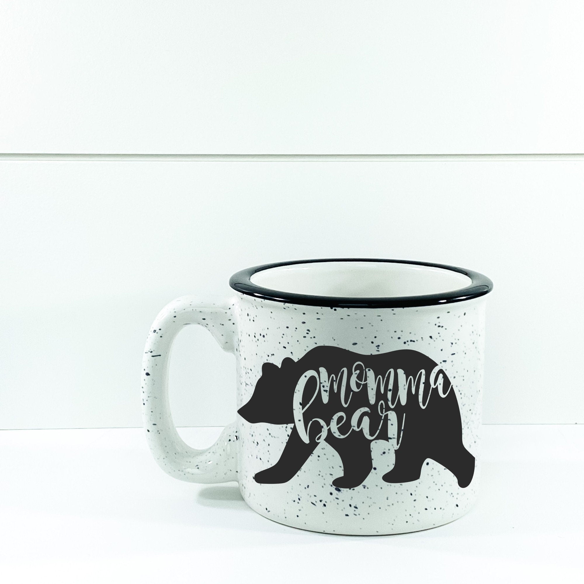 Momma Bear Campfire Mug, a ceramic mug with a unique vinyl design, perfect for outdoor adventures and cozy drinks.