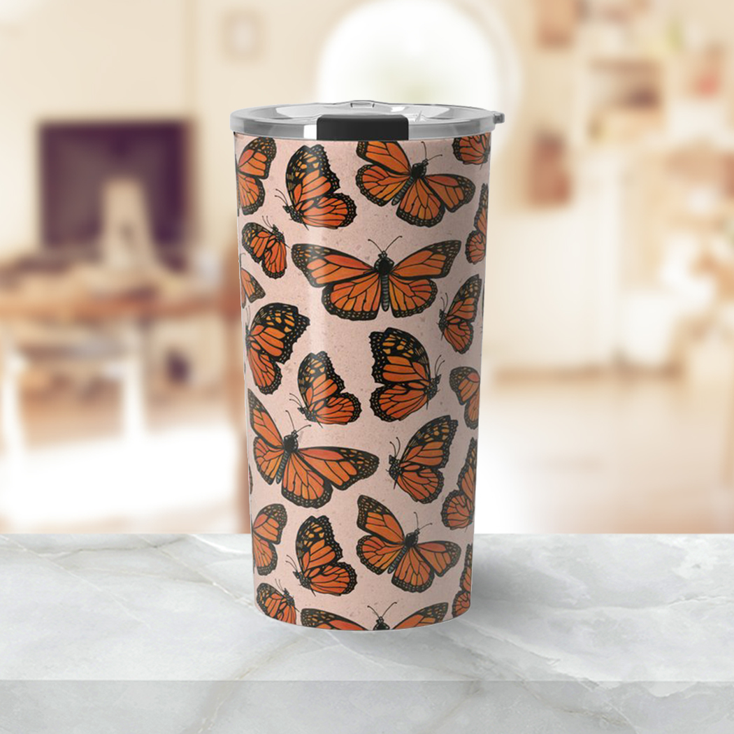 Monarch Butterfly Travel Coffee Mug showcasing vibrant butterfly artwork on a stainless steel body.