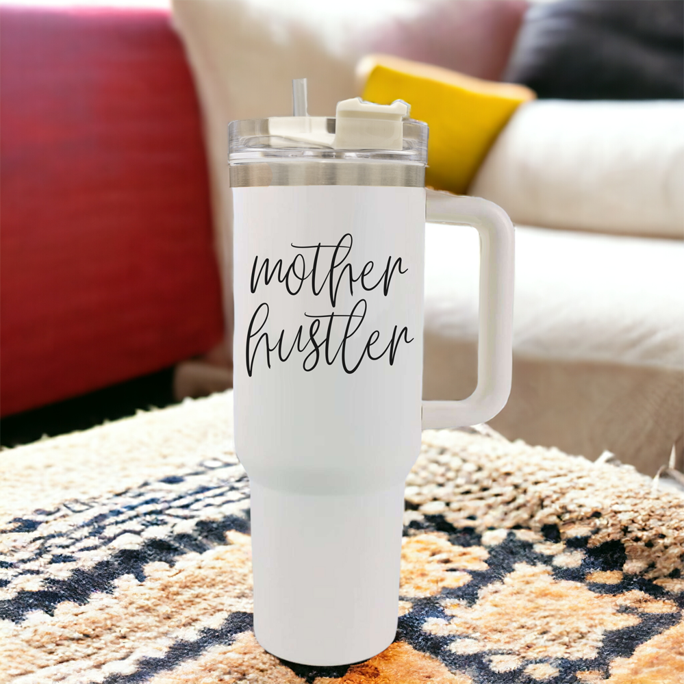 Mother Hustler 40oz tumbler with matte finish, featuring a bold black graphic on a cream exterior, designed for busy moms.