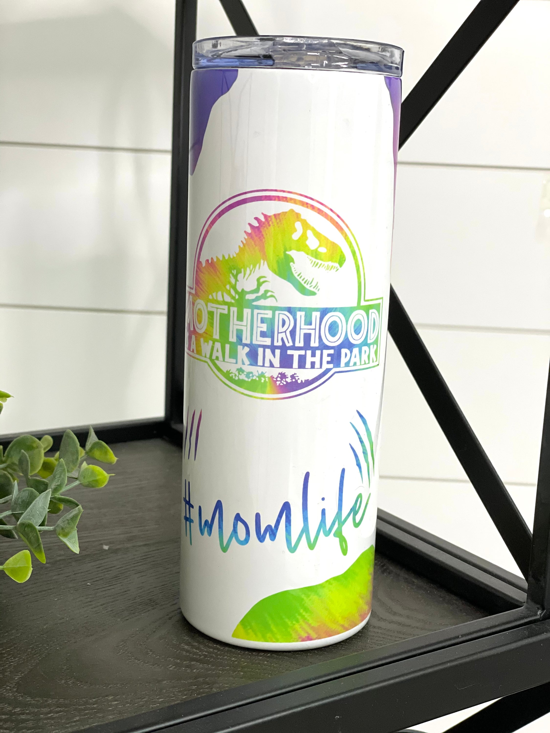 Motherhood #MOMLIFE 20oz Skinny Tumbler with a stylish design, featuring a reusable straw, perfect for busy moms.