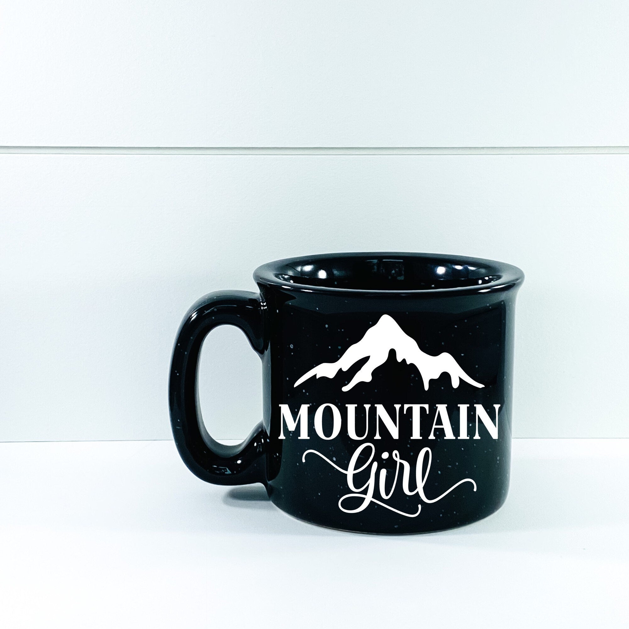 Mountain Girl Campfire Mug, a ceramic mug with a unique design, perfect for outdoor use and stylish enough for home.