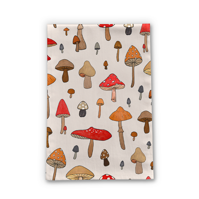 A cozy mushroom-themed tea towel made of cotton twill, featuring a whimsical design and hemmed edges, perfect for kitchen use.