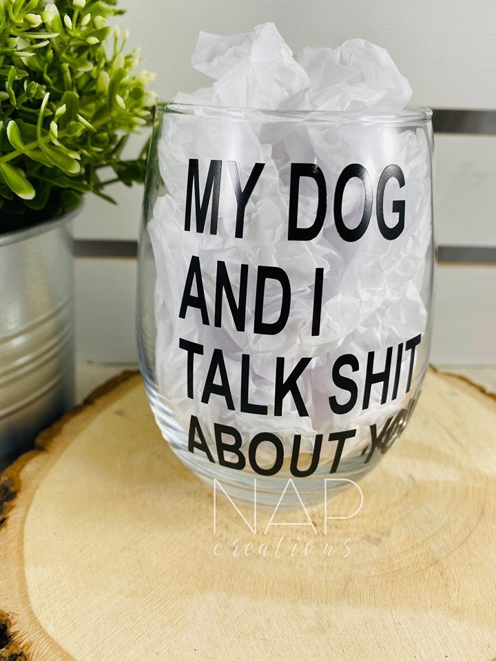 A humorous stemless wine glass featuring the phrase 'My Dog and I Talk Shit About You', perfect for dog lovers.