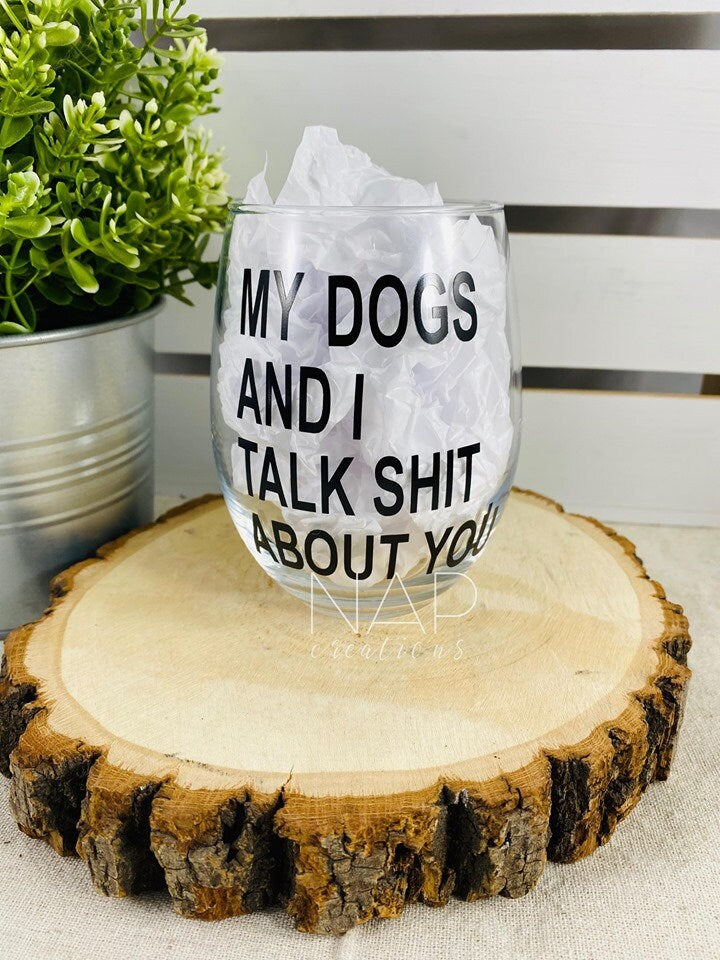 A humorous stemless wine glass featuring the phrase 'My Dog and I Talk Shit About You', perfect for dog lovers.