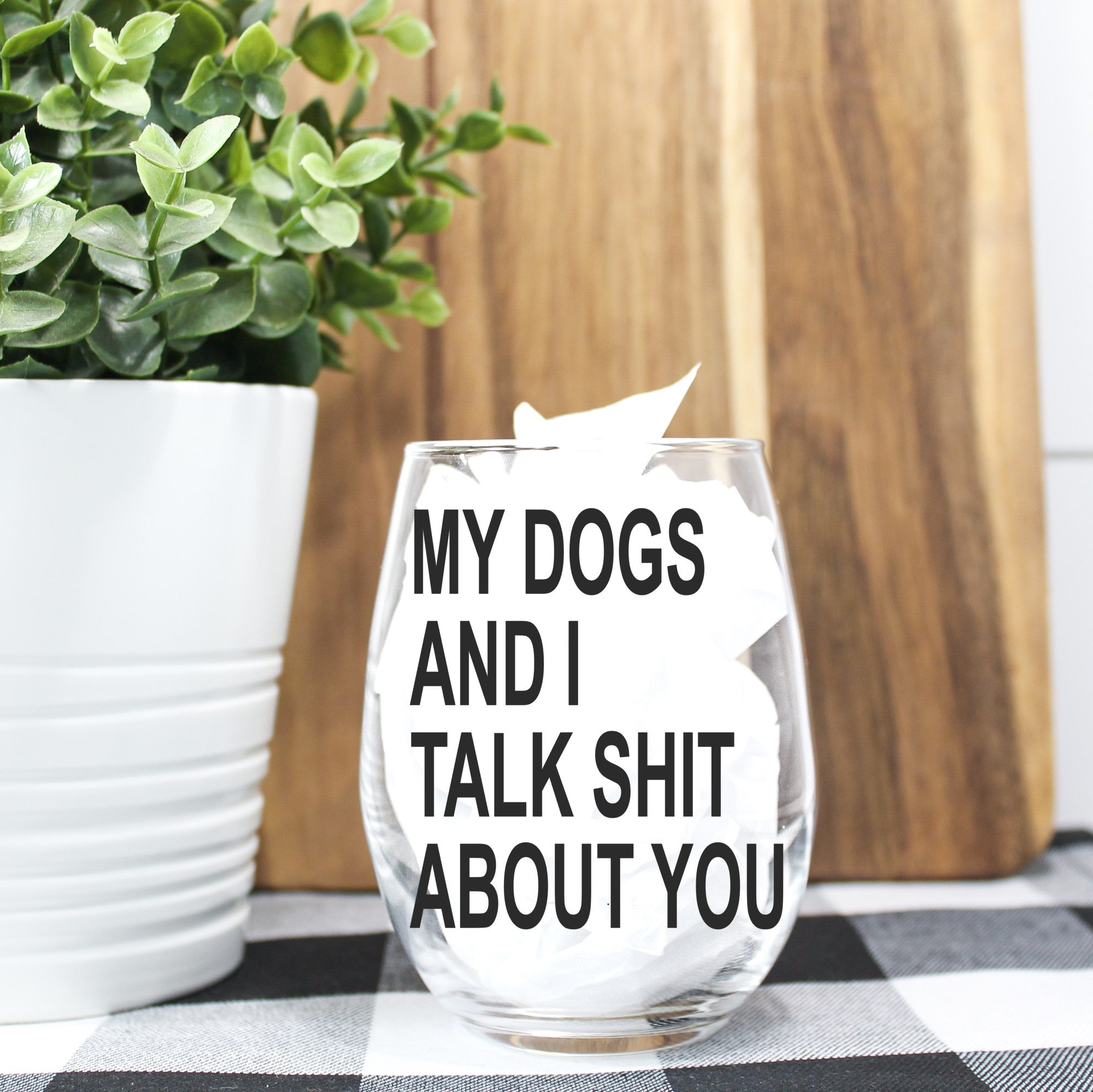 A humorous stemless wine glass featuring the phrase 'My Dog and I Talk Shit About You', perfect for dog lovers.