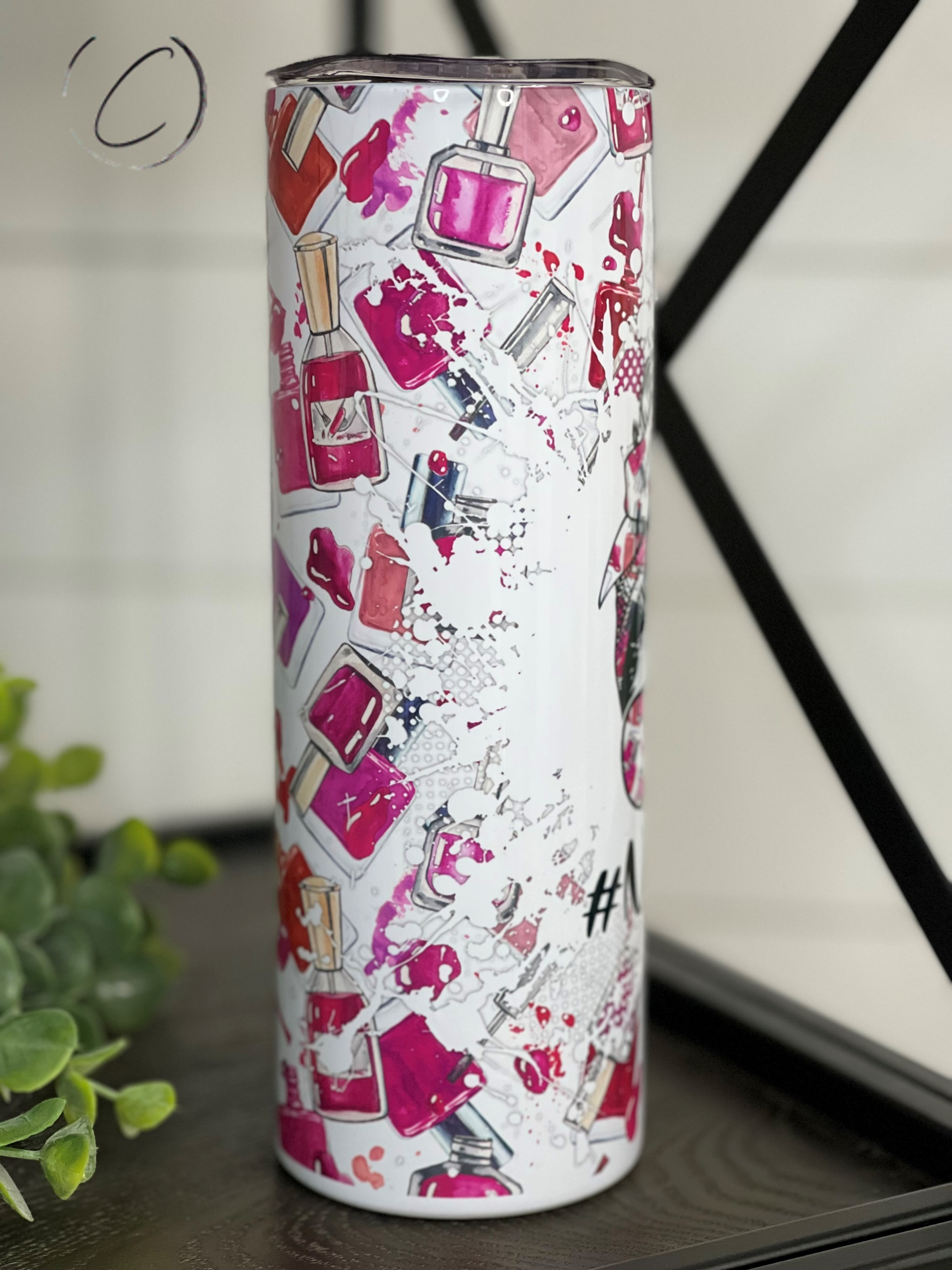 A stylish #NailBoss 20oz Skinny Tumbler featuring a vibrant full wrap design, perfect for hot and cold beverages.