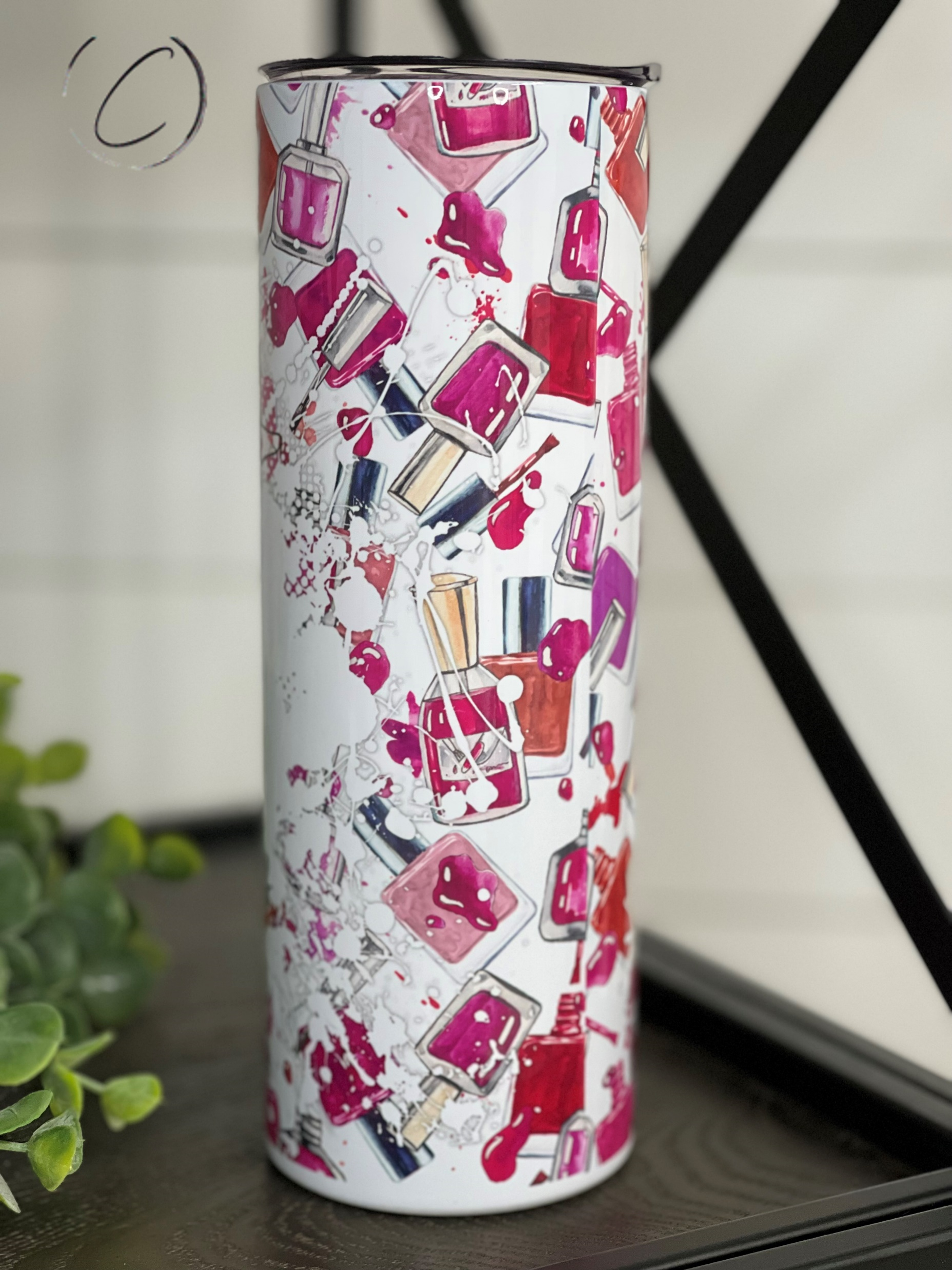 A stylish #NailBoss 20oz Skinny Tumbler featuring a vibrant full wrap design, perfect for hot and cold beverages.