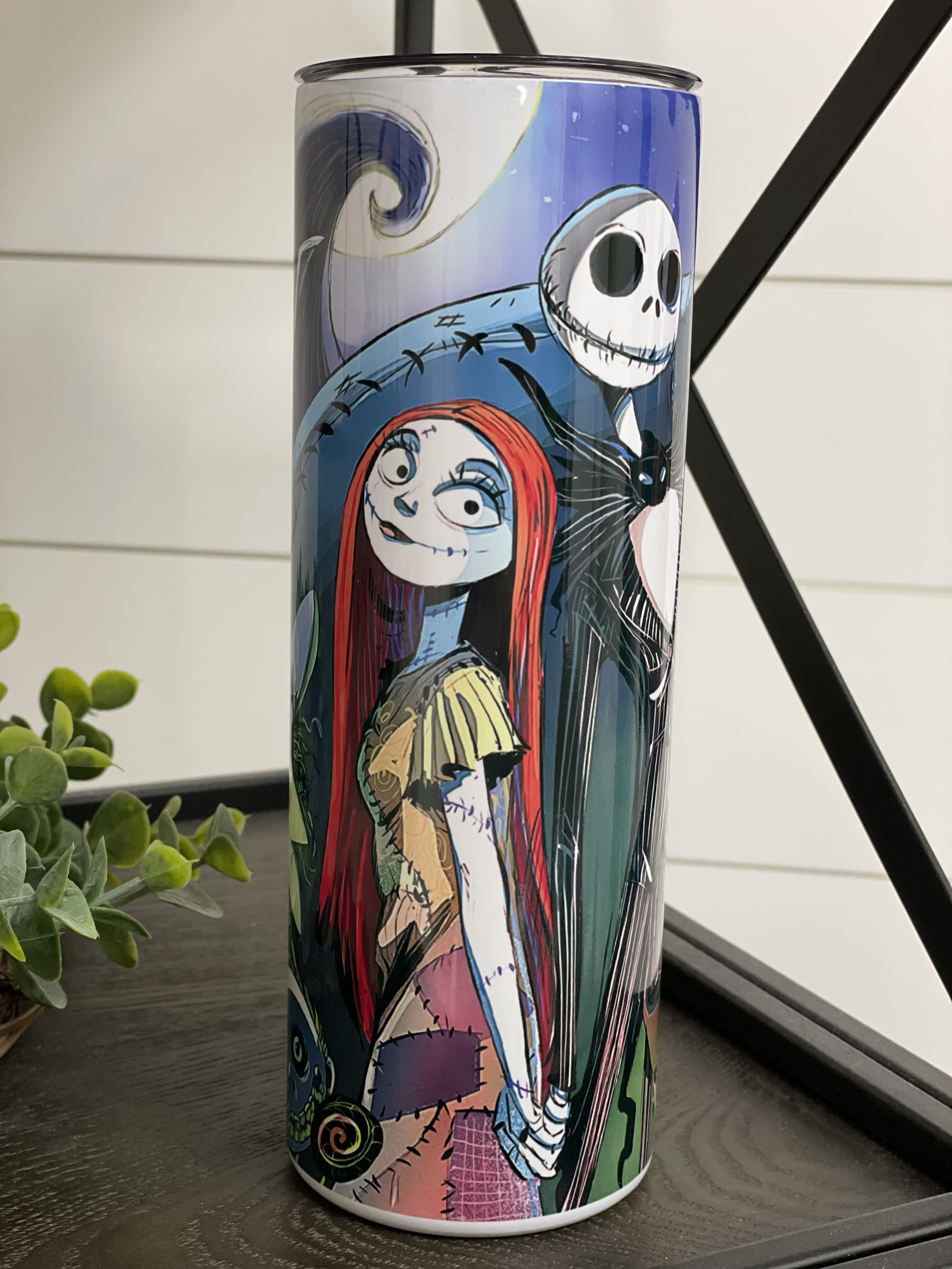 Nightmare Before Christmas 20oz skinny tumbler featuring a vibrant full wrap design, perfect for hot and cold beverages.