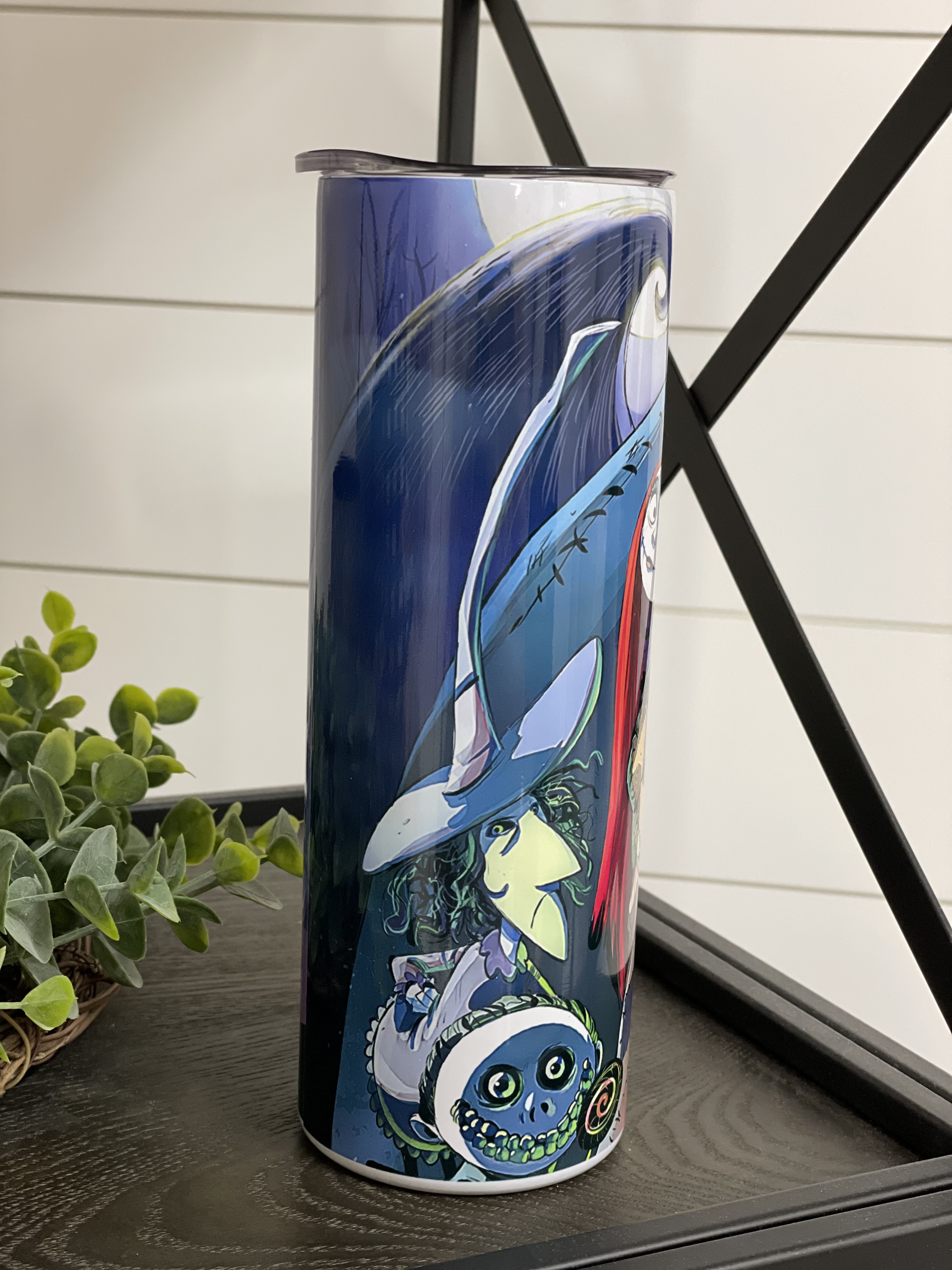 Nightmare Before Christmas 20oz skinny tumbler featuring a vibrant full wrap design, perfect for hot and cold beverages.