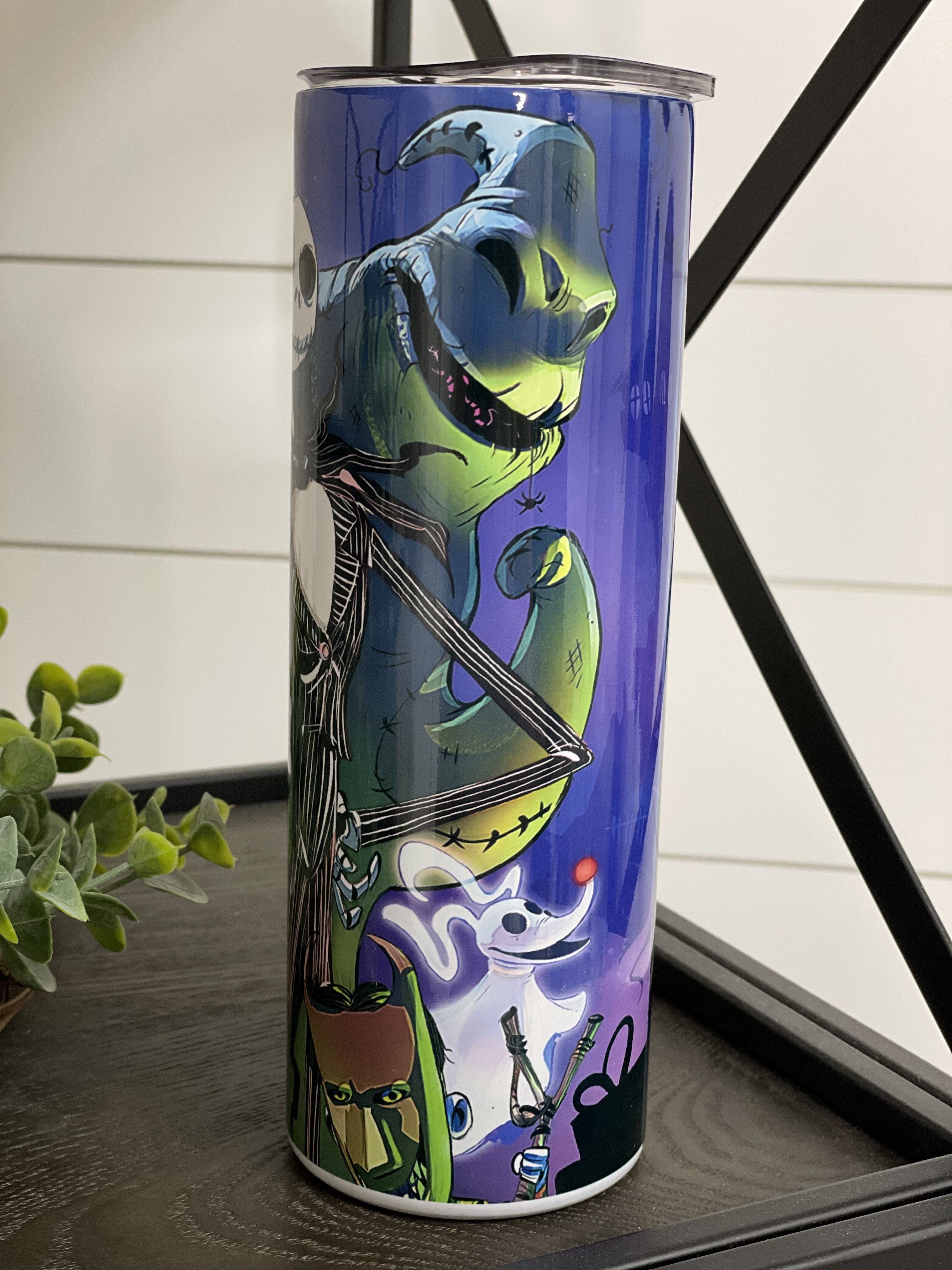 Nightmare Before Christmas 20oz skinny tumbler featuring a vibrant full wrap design, perfect for hot and cold beverages.