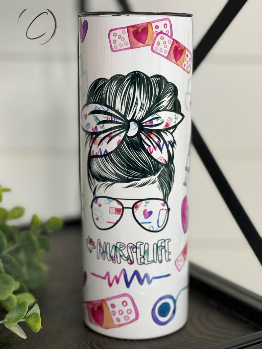 A stylish #Nurselife 20oz skinny tumbler featuring a vibrant full wrap design, perfect for nurses and healthcare professionals.