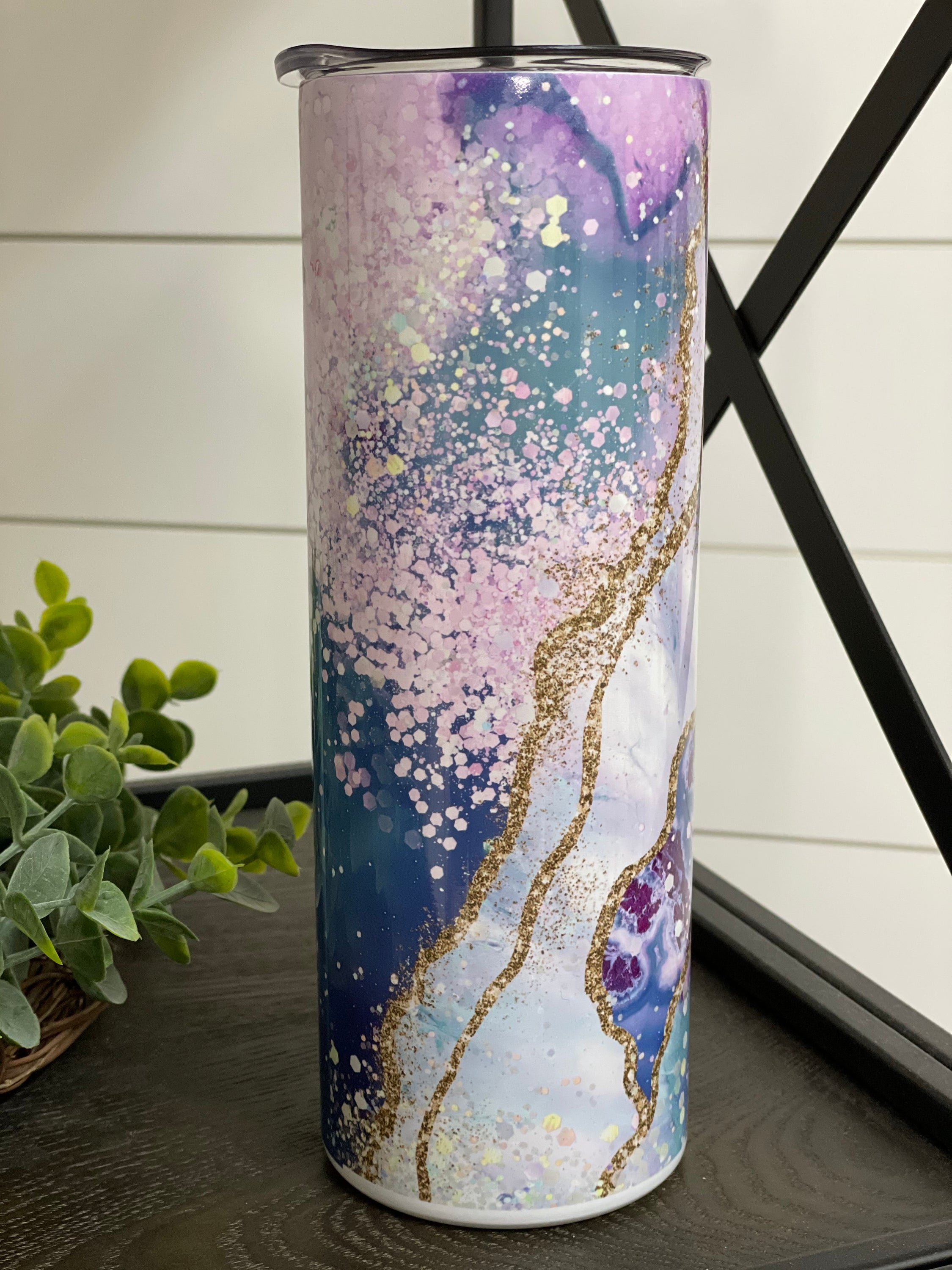 Ocean Geode 20oz Skinny Tumbler with a vibrant oceanic design, featuring a reusable straw and a durable construction.