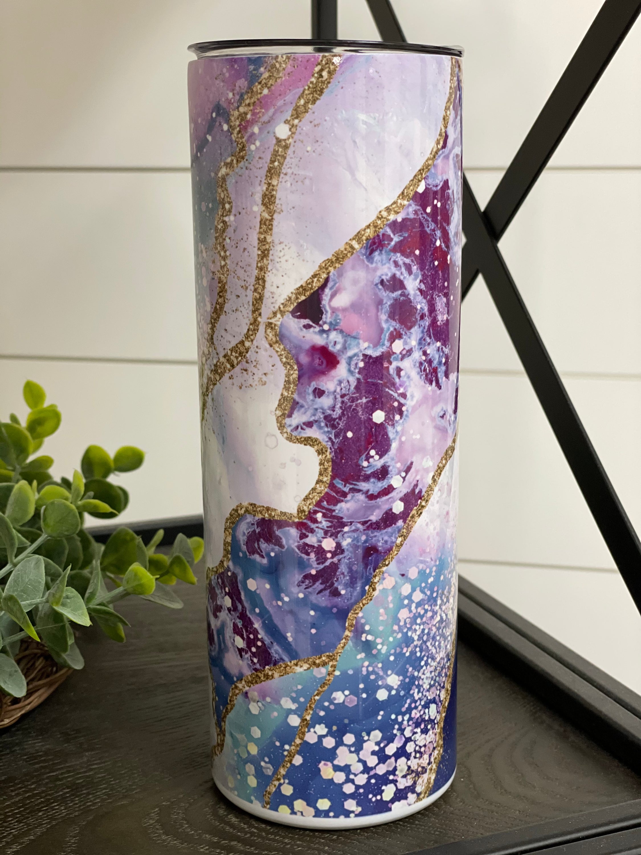 Ocean Geode 20oz Skinny Tumbler with a vibrant oceanic design, featuring a reusable straw and a durable construction.