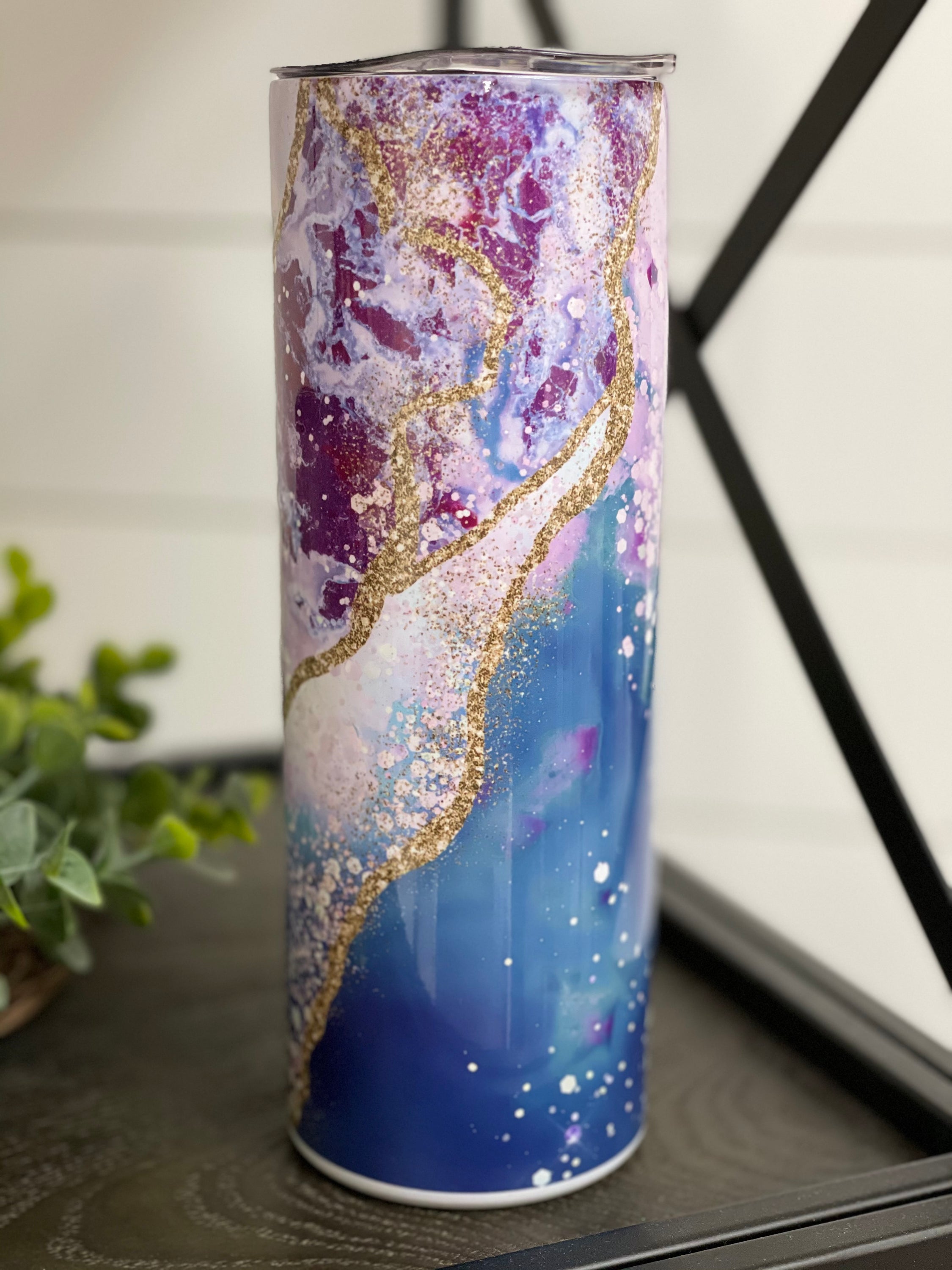 Ocean Geode 20oz Skinny Tumbler with a vibrant oceanic design, featuring a reusable straw and a durable construction.