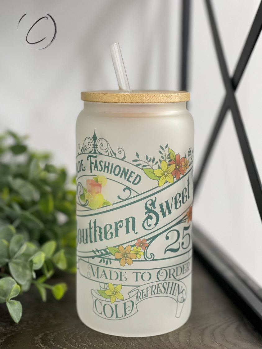 A stylish 16oz Libbey Glass tumbler designed for Olde Fashioned Southern Sweet Tea, featuring a frosted appearance and a reusable straw.