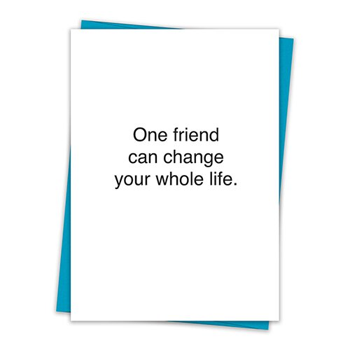 A greeting card featuring the phrase 'One friend can change your whole life' with a teal envelope, made from recycled cardstock.